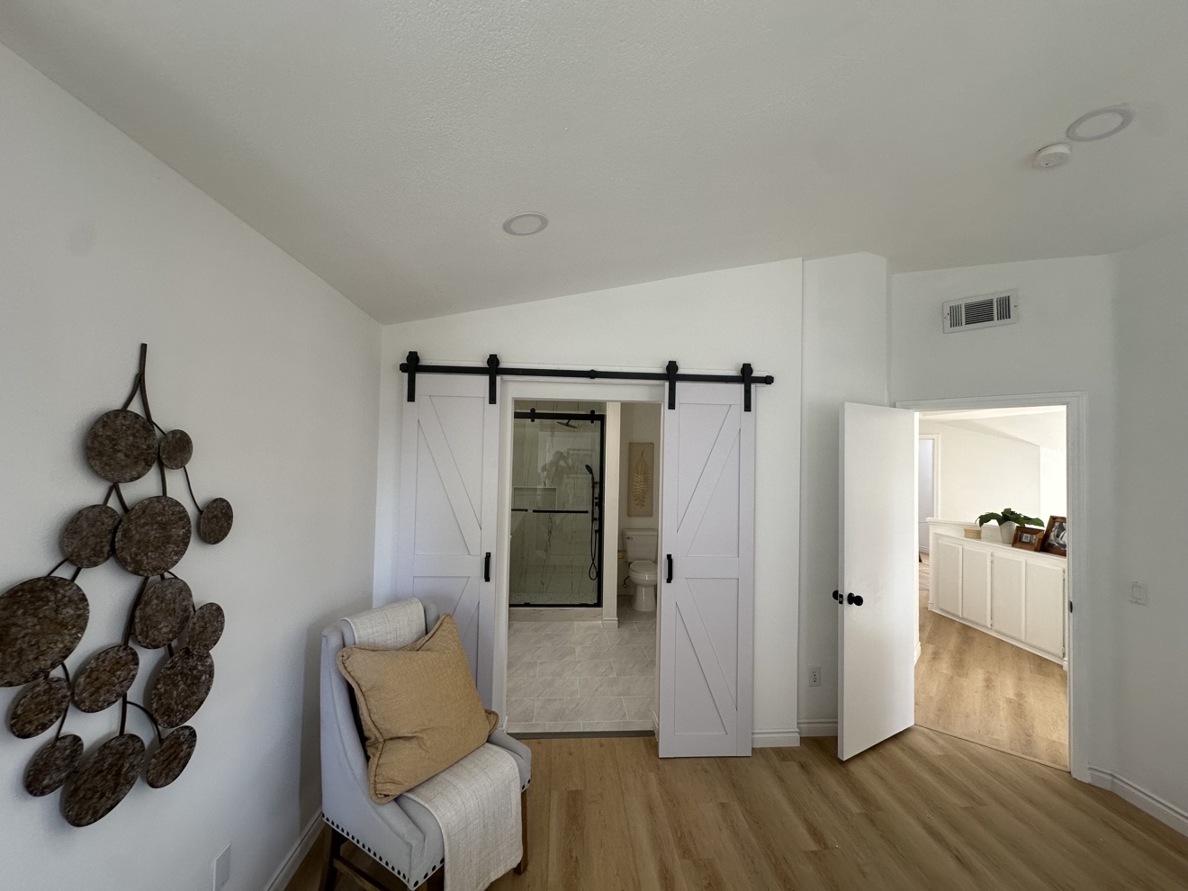 Rancho Cucamonga whole home remodel — bedroom with barn doors