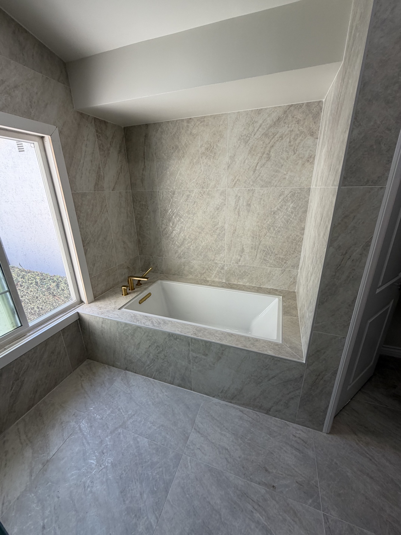 Lake Forest master bathroom remodel by Tiannuo Construction - tub