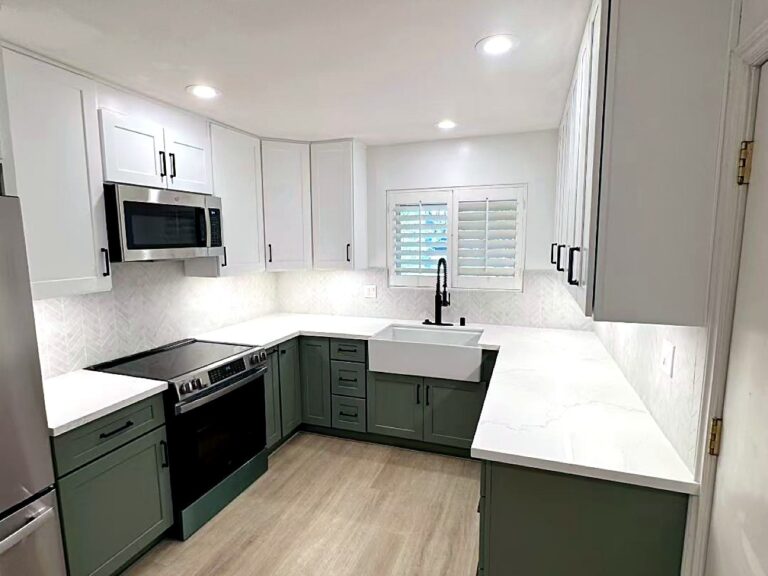 Completed sage green and white kitchen remodel with farmhouse sink by Tiannuo Construction